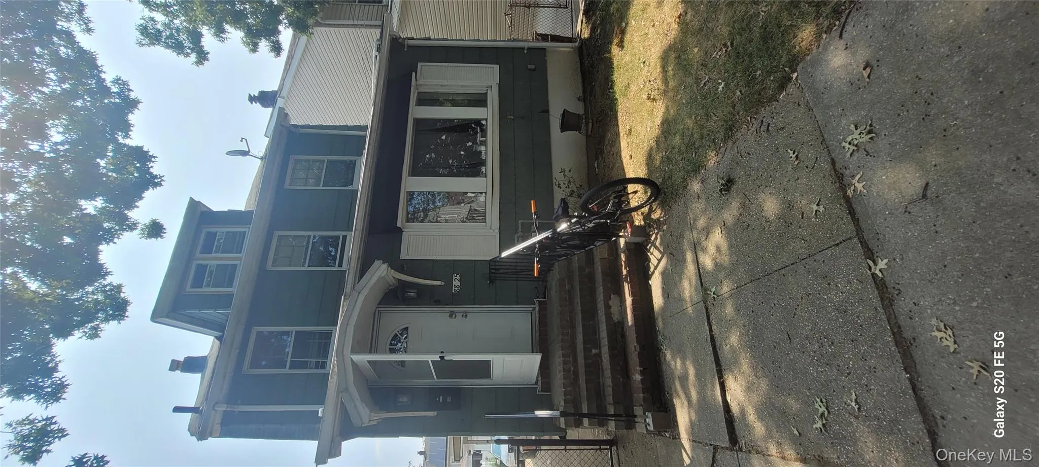 American foursquare style home featuring a chimney American foursquare style home featuring a chimney