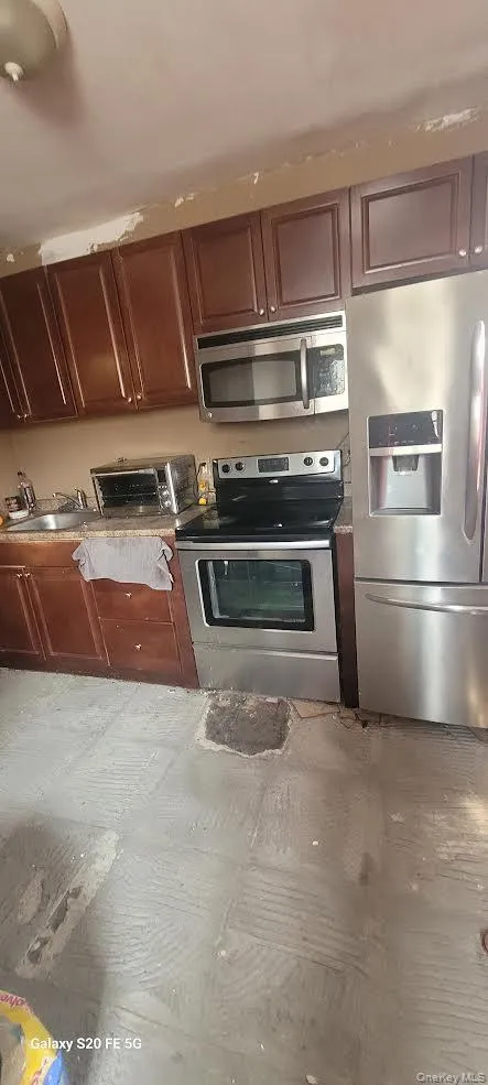 1st Floor Kitchen featuring appliances with stainless steel finishes 1st Floor Kitchen featuring appliances with stainless steel finishes