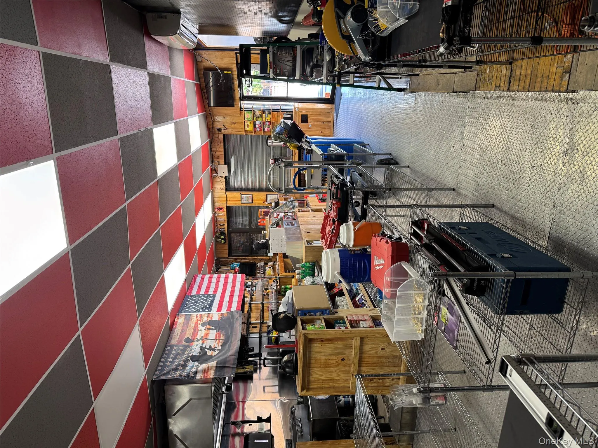 Basement featuring a paneled ceiling and wood finished floors Basement featuring a paneled ceiling and wood finished floors