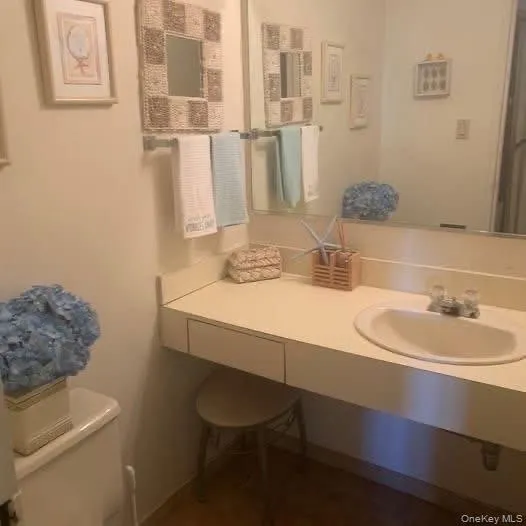 Half bathroom with vanity and toilet Half bathroom with vanity and toilet