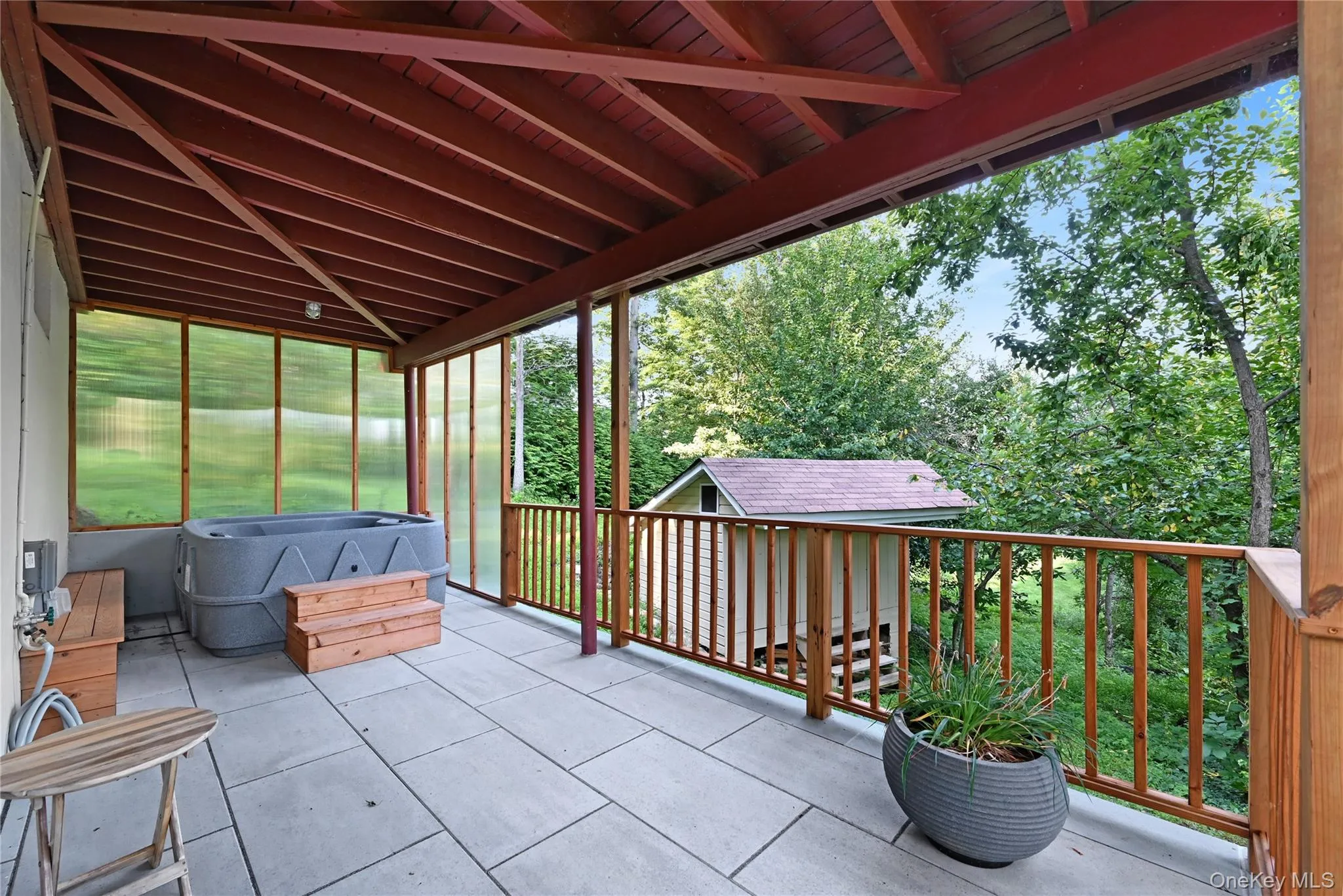 View of patio / terrace with a jacuzzi View of patio / terrace with a jacuzzi