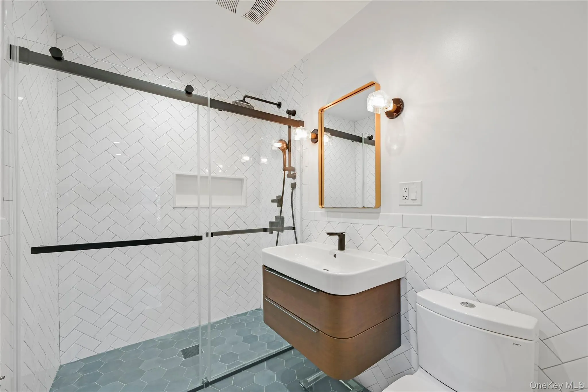Full bathroom featuring tile walls, vanity, and a shower stall Full bathroom featuring tile walls, vanity, and a shower stall