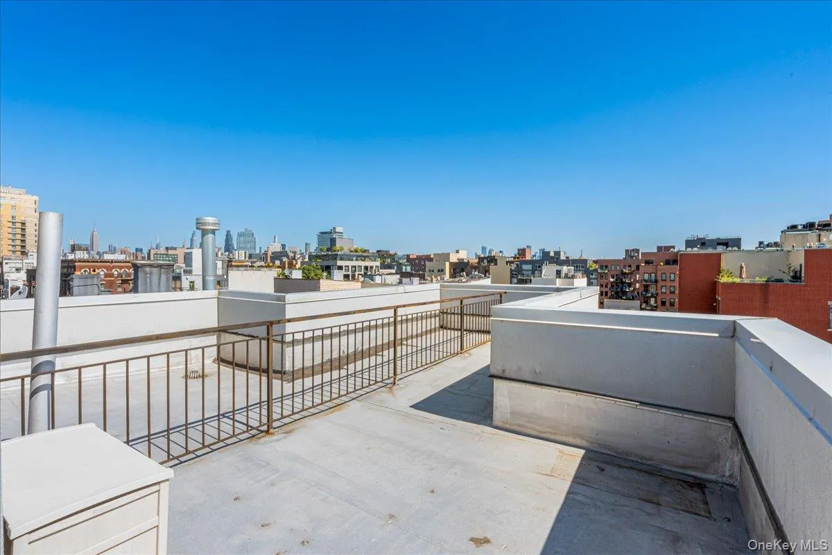 View of patio featuring a skyline view View of patio featuring a skyline view