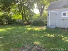 View of yard with a storage unit View of yard with a storage unit