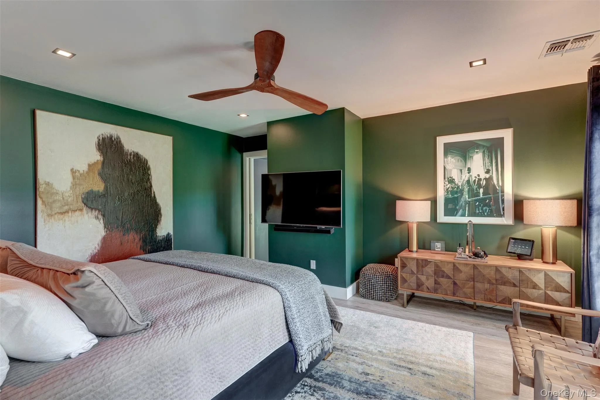 Bedroom with wood finished floors, ceiling fan, and recessed lighting Bedroom with wood finished floors, ceiling fan, and recessed lighting