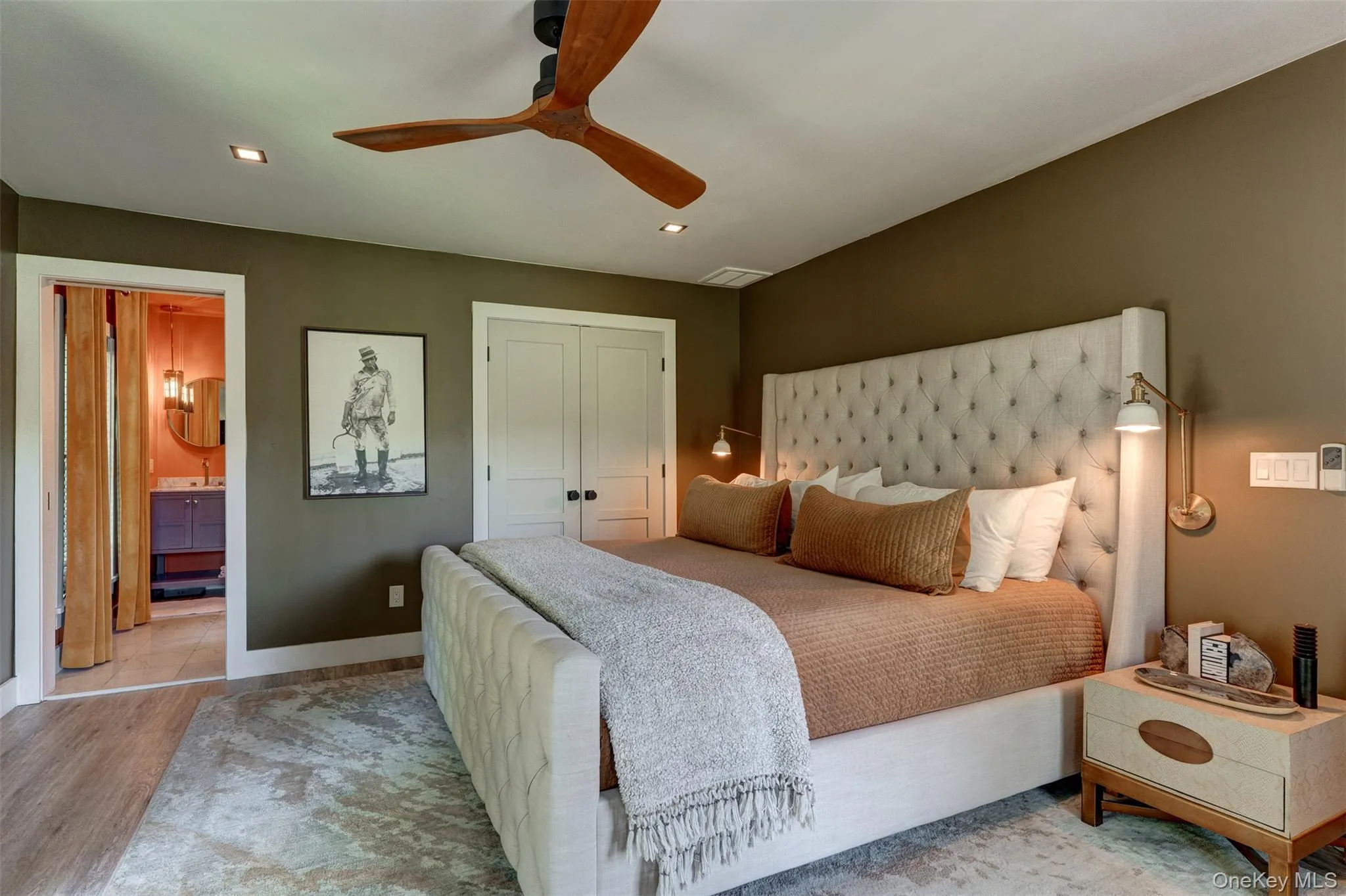 Bedroom with a closet, recessed lighting, wood finished floors, ceiling fan, and ensuite bath Bedroom with a closet, recessed lighting, wood finished floors, ceiling fan, and ensuite bath