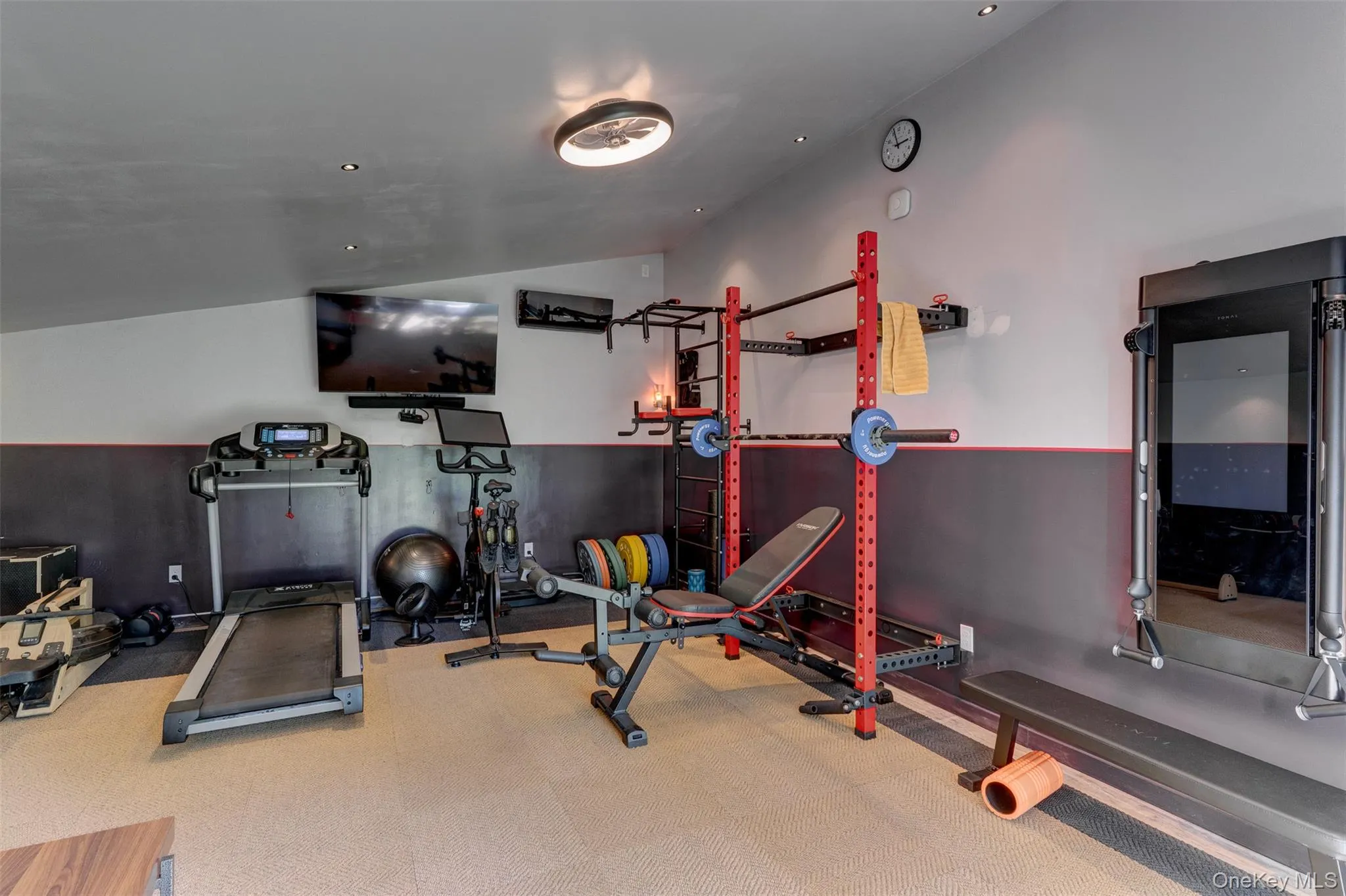 Exercise area with lofted ceiling Exercise area with lofted ceiling