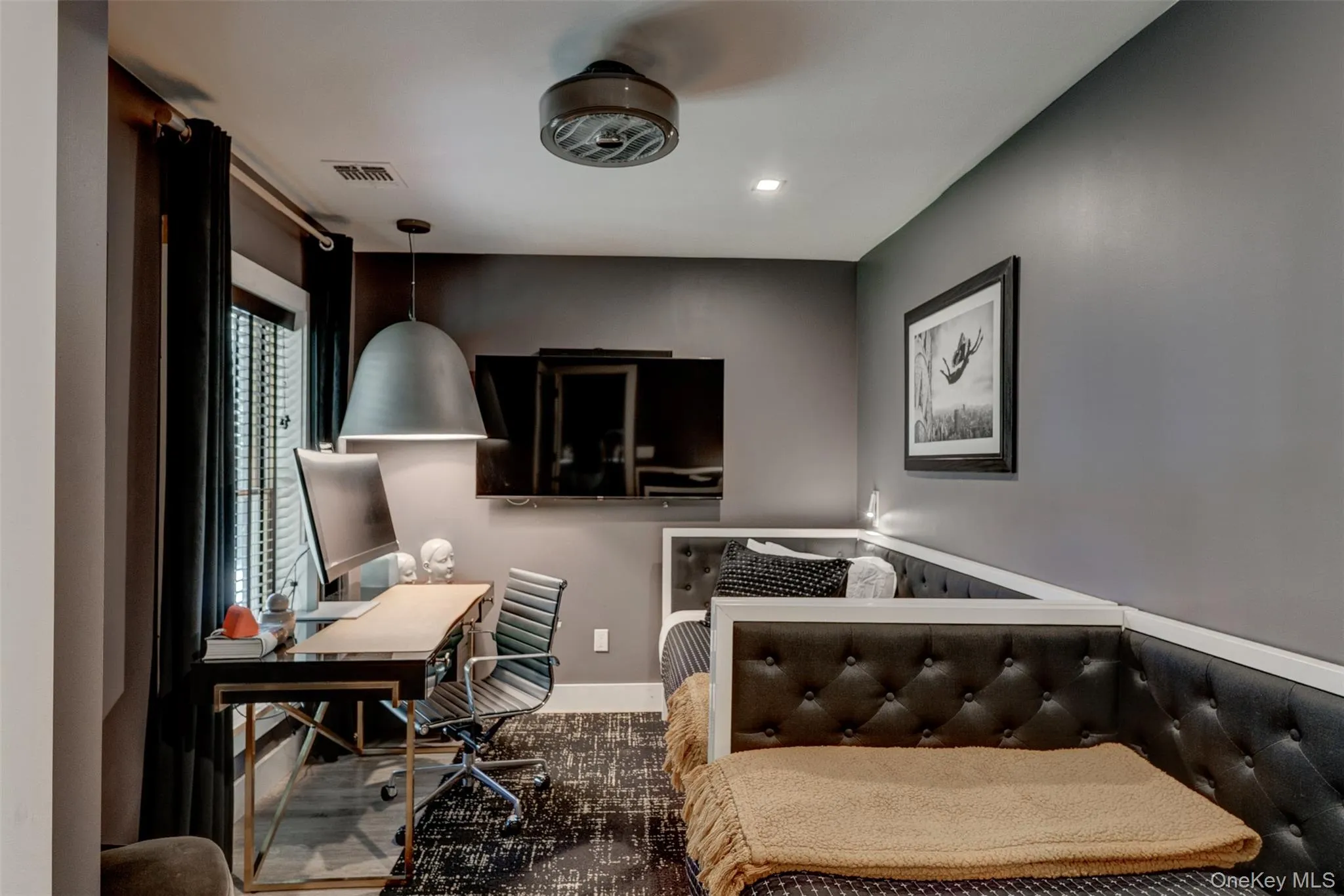 Bedroom with an office area and recessed lighting Bedroom with an office area and recessed lighting