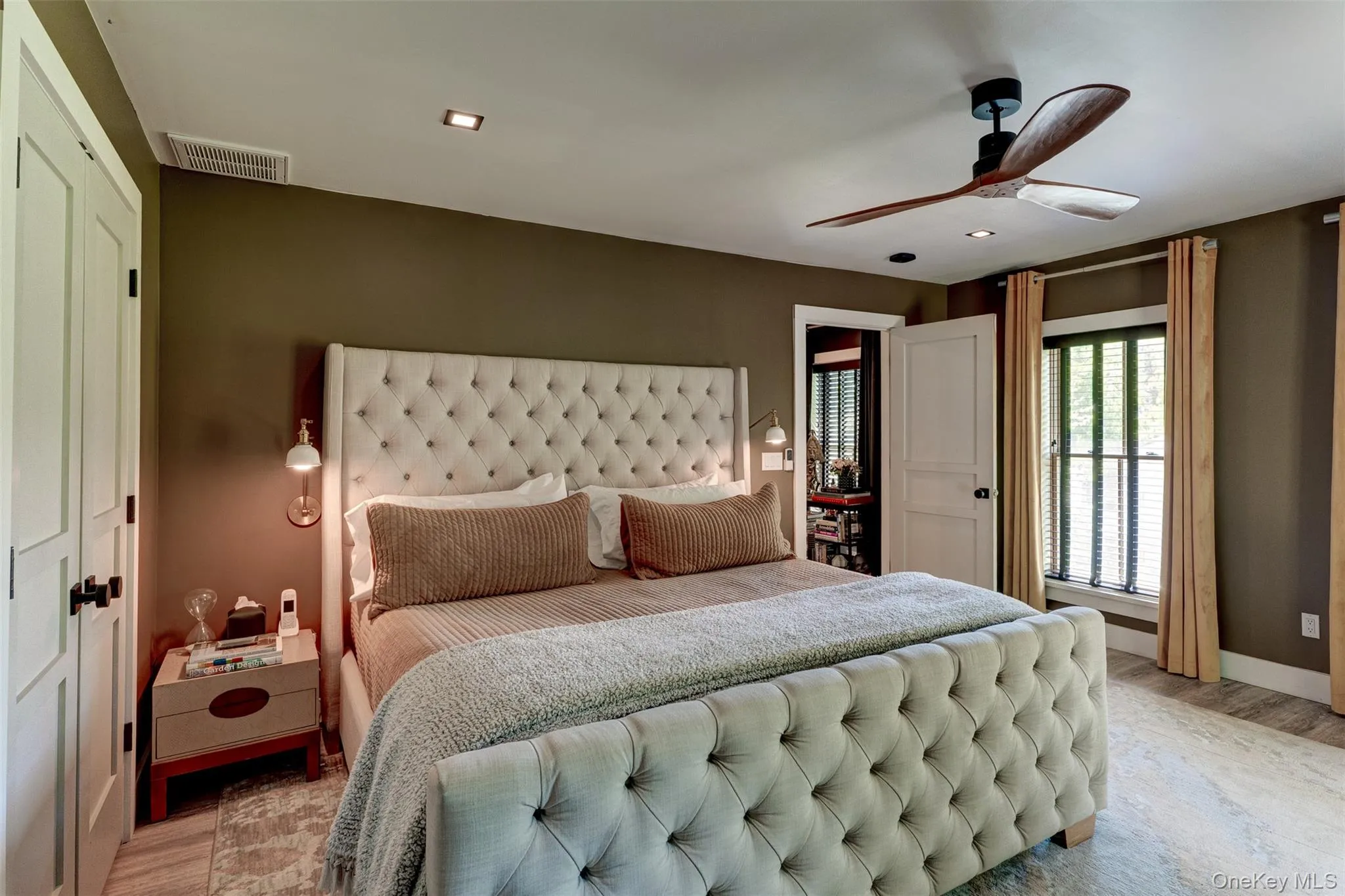 Bedroom featuring light wood-style floors, a ceiling fan, and recessed lighting Bedroom featuring light wood-style floors, a ceiling fan, and recessed lighting