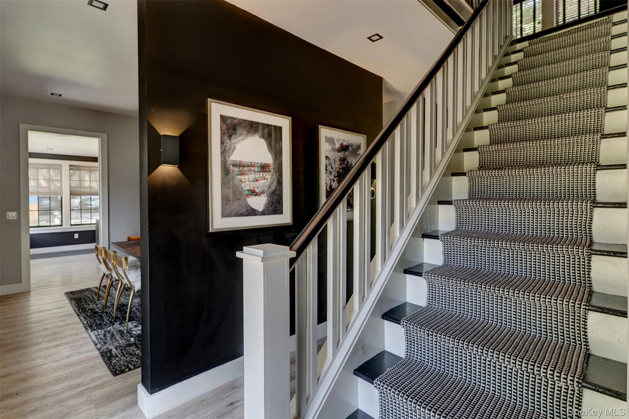 Stairs featuring baseboards and wood finished floors Stairs featuring baseboards and wood finished floors