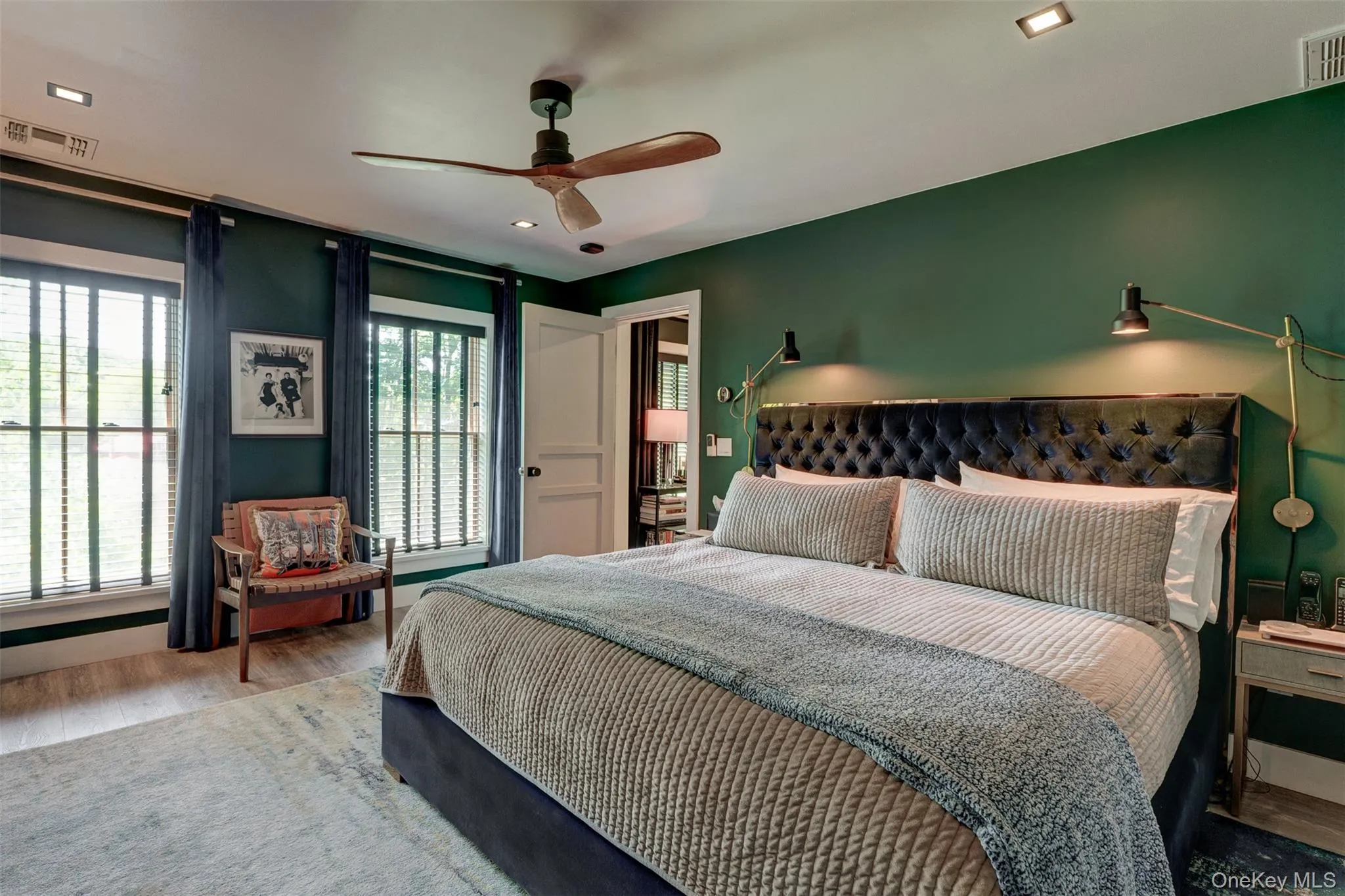 Bedroom with wood finished floors, ceiling fan, and recessed lighting Bedroom with wood finished floors, ceiling fan, and recessed lighting