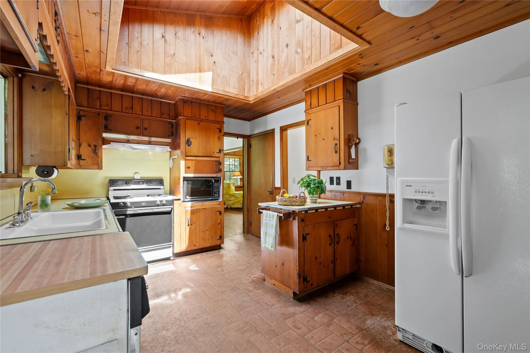 Kitchen with wooden ceiling with skylight Kitchen with wooden ceiling with skylight