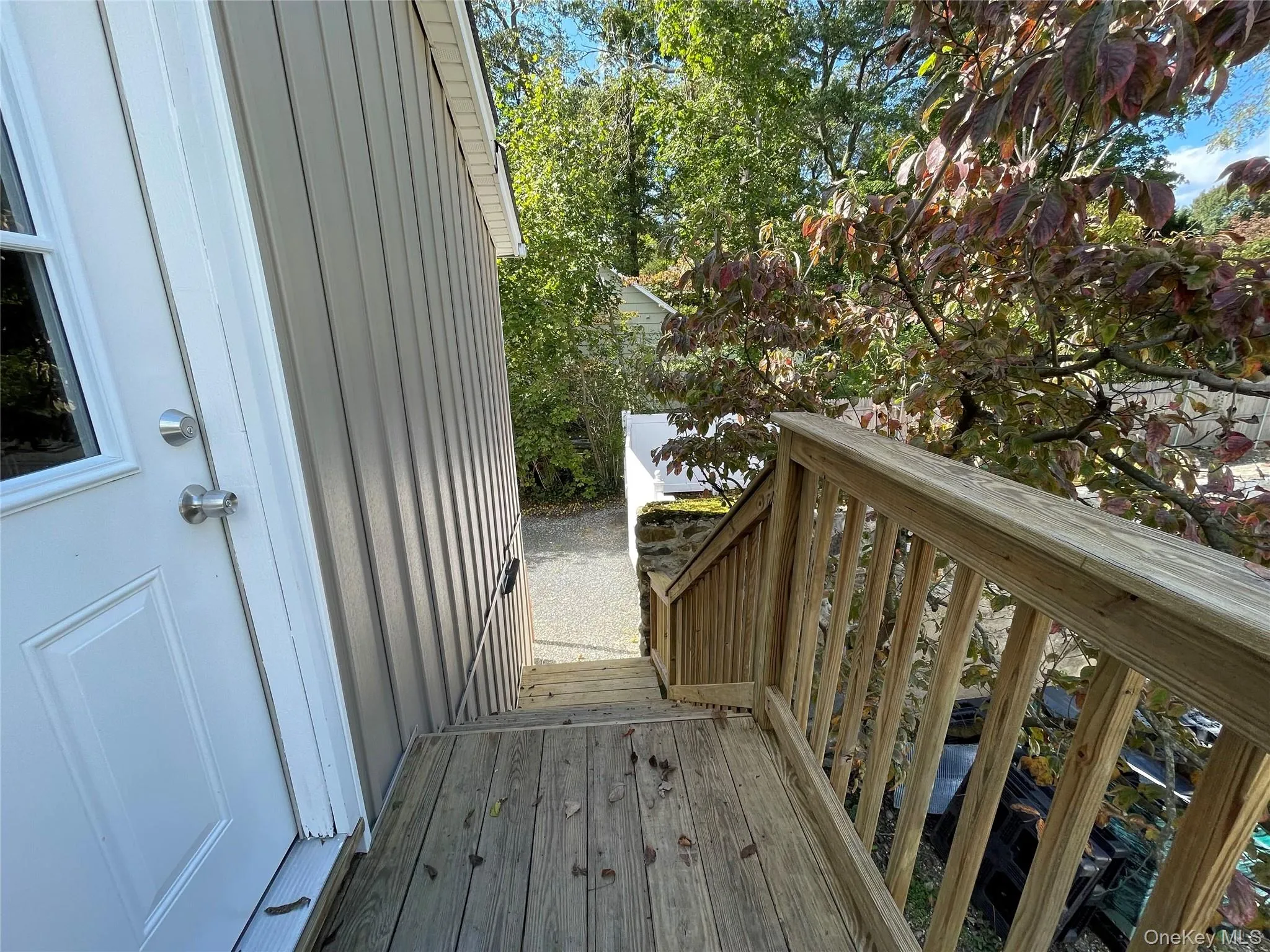 View of wooden deck leading out of the second floor office space. View of wooden deck leading out of the second floor office space.