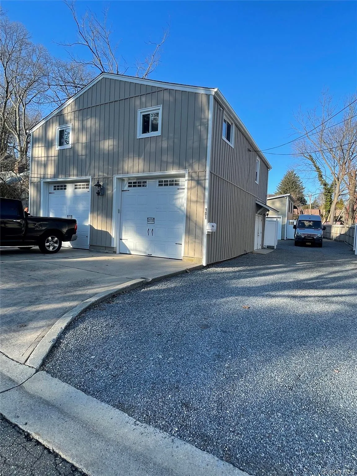 View of outbuilding featuring driveway View of outbuilding featuring driveway