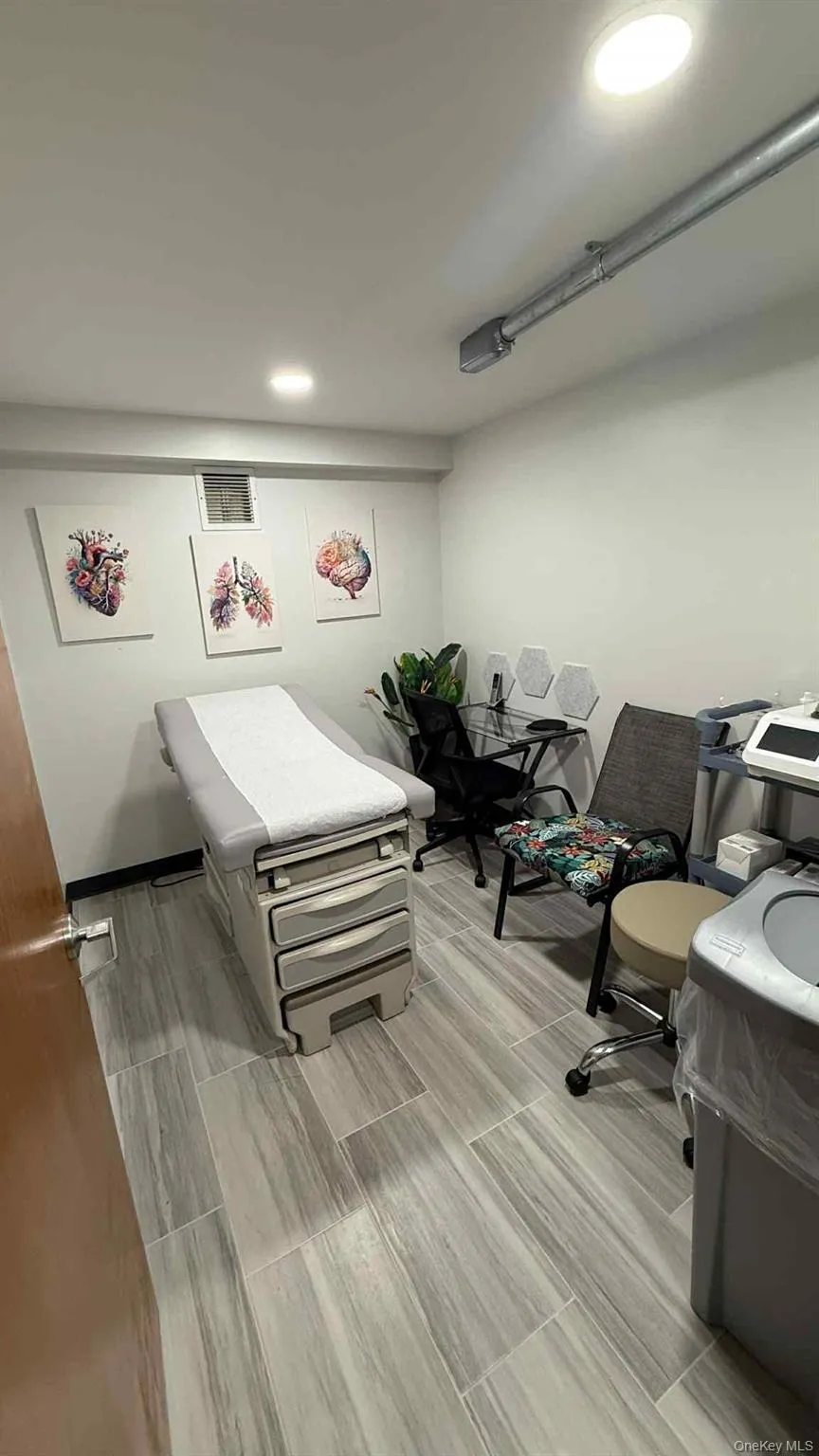 Bedroom with recessed lighting and an office area Bedroom with recessed lighting and an office area