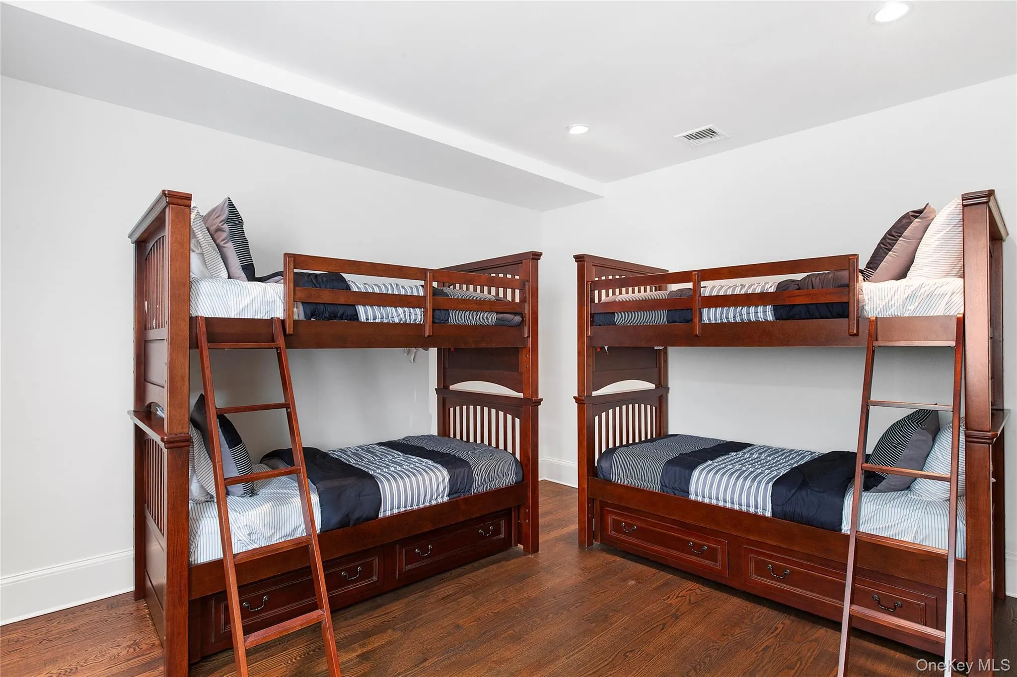 Bedroom featuring dark wood-style flooring and recessed lighting