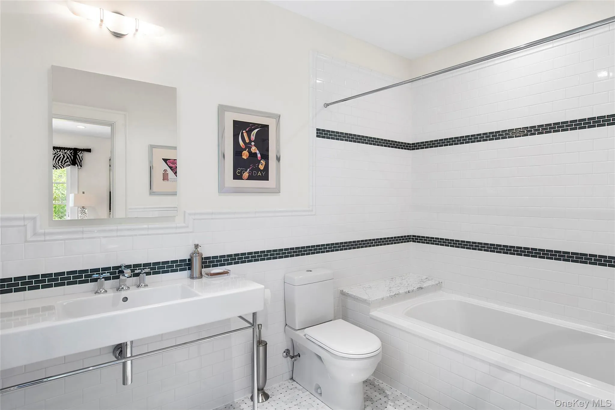 Full bathroom with tile walls, recessed lighting, and tiled shower / bath combo