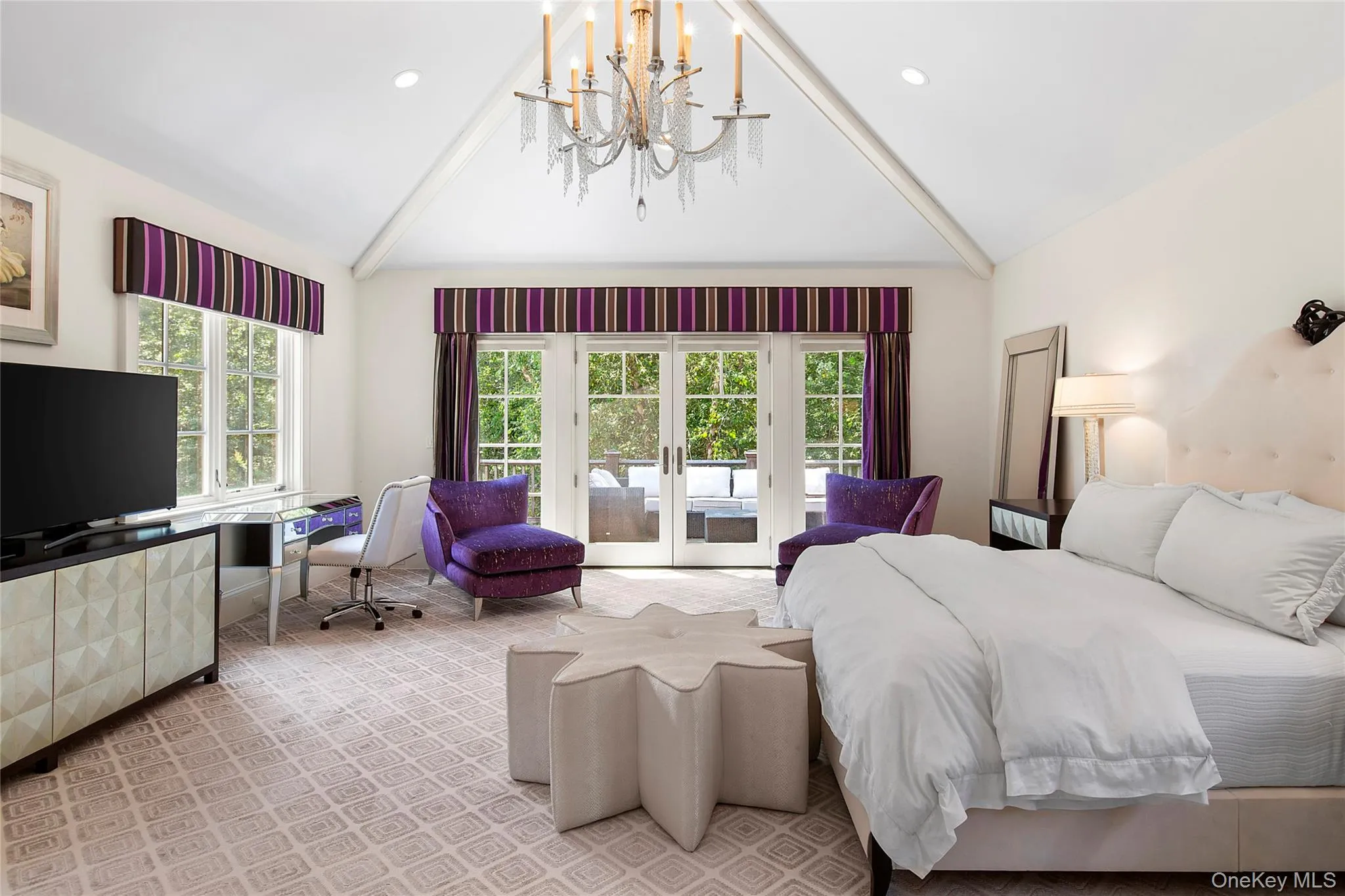 Bedroom with access to outside, carpet floors, a chandelier, french doors, and high vaulted ceiling