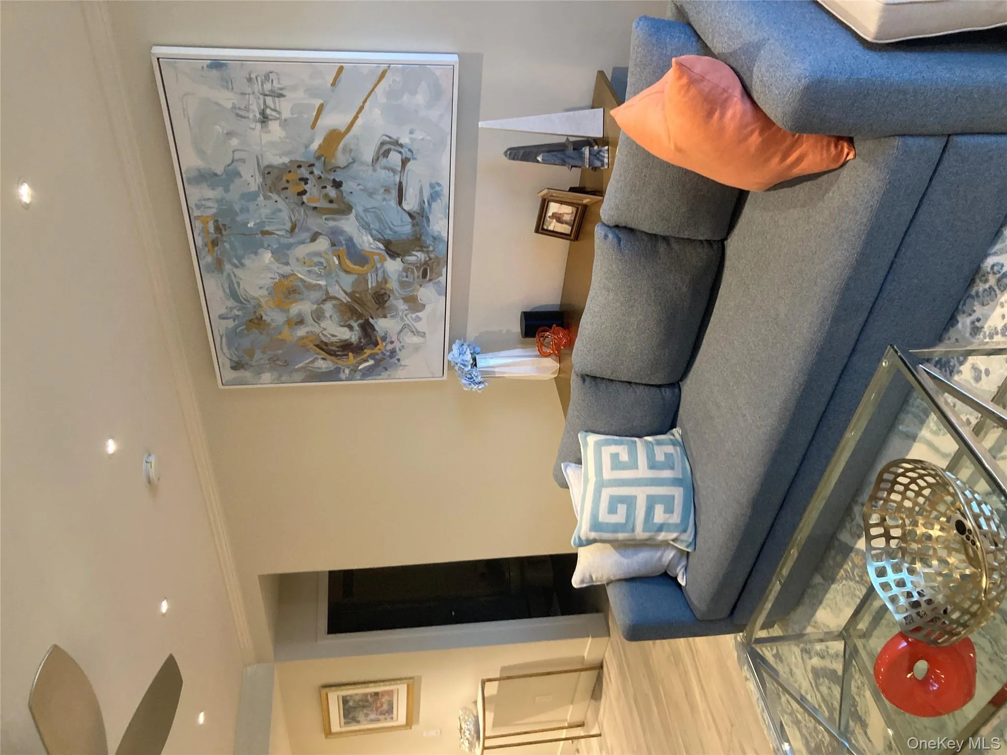 Living room featuring ornamental molding, recessed lighting, wood finished floors, and ceiling fan Living room featuring ornamental molding, recessed lighting, wood finished floors, and ceiling fan