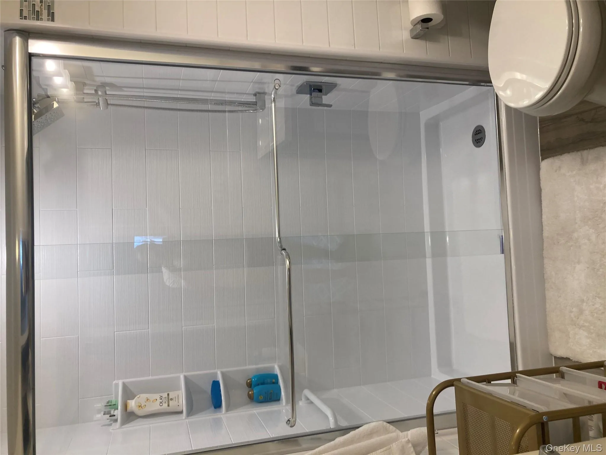 Full bathroom with a shower stall Full bathroom with a shower stall