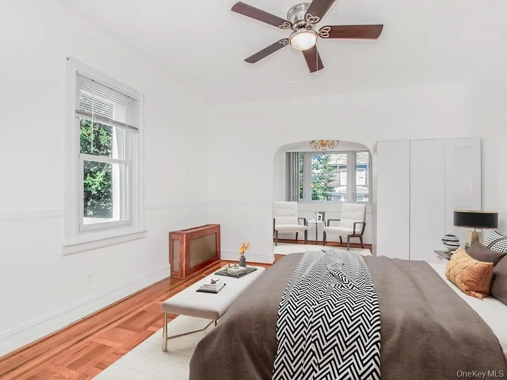 Bedroom with ceiling fan and a chandelier Bedroom with ceiling fan and a chandelier