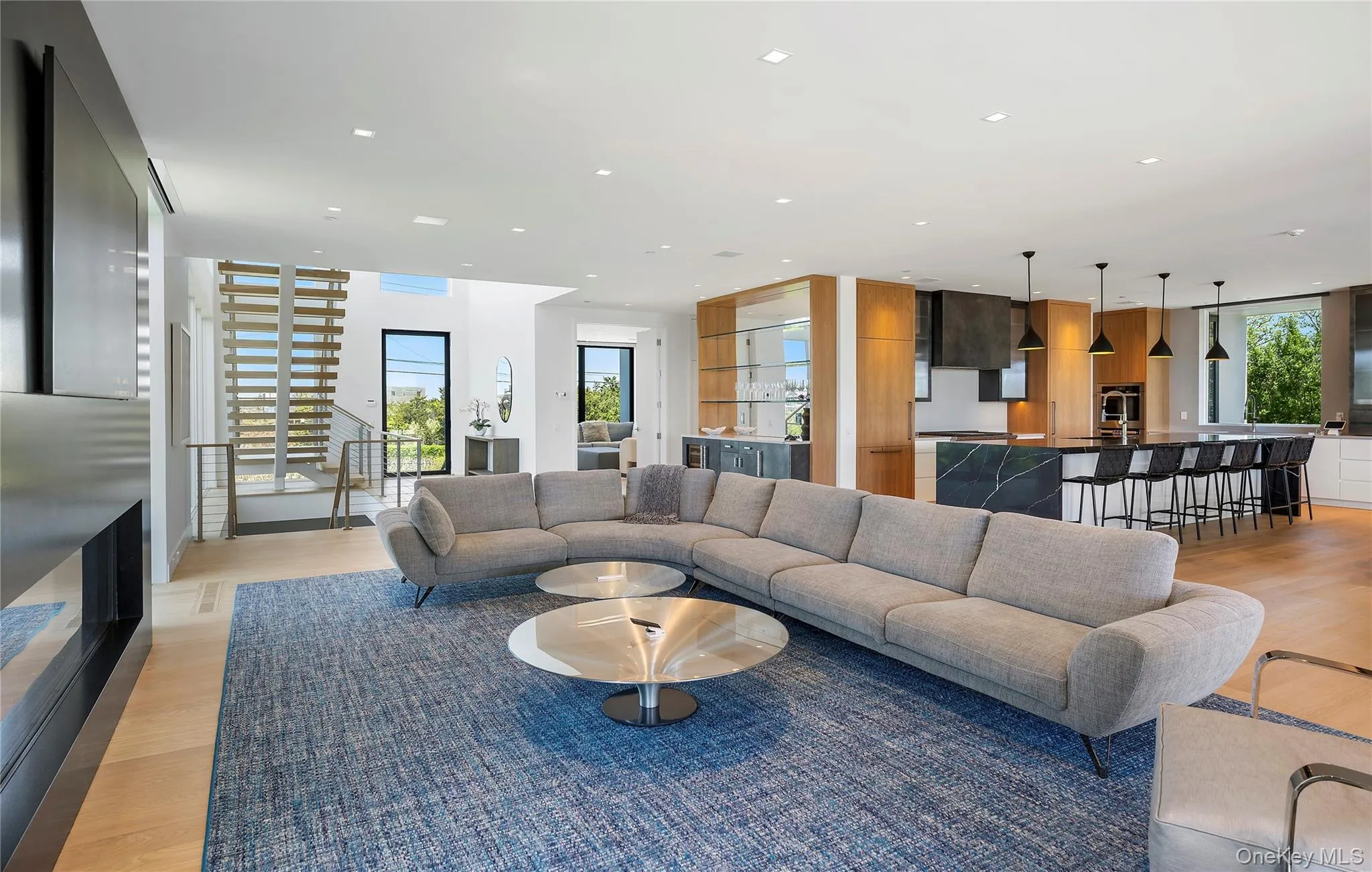 Living area featuring light wood finished floors and recessed lighting Living area featuring light wood finished floors and recessed lighting