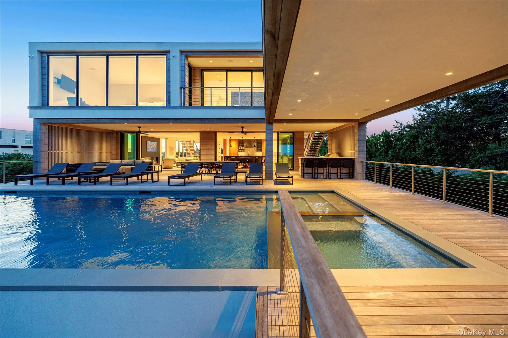 Swimming pool featuring an in-ground hot tub, a balcony, and a patio Swimming pool featuring an in-ground hot tub, a balcony, and a patio