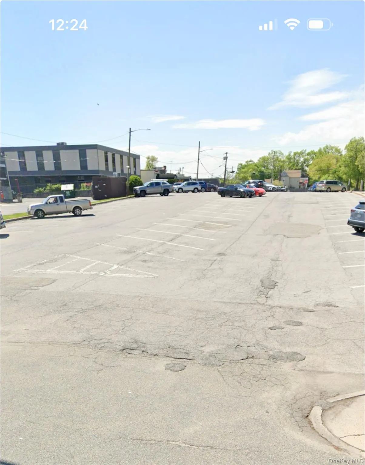 View of uncovered parking lot View of uncovered parking lot