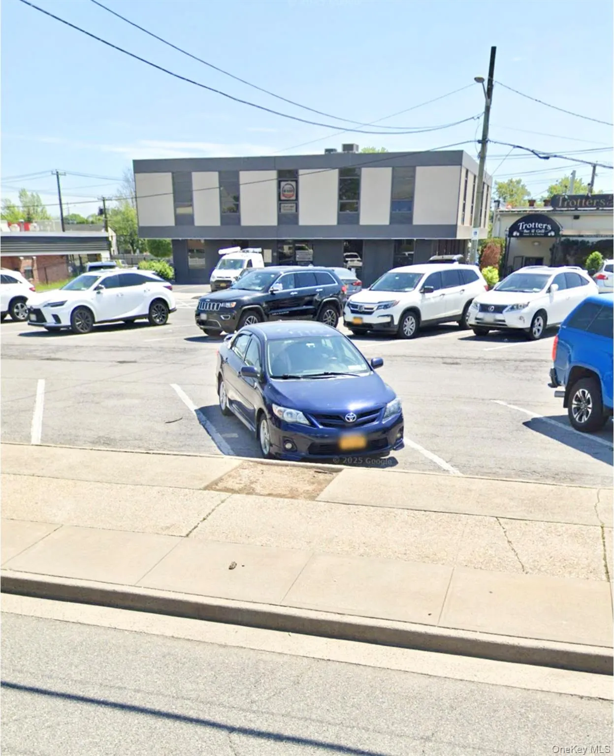 View of uncovered parking lot View of uncovered parking lot
