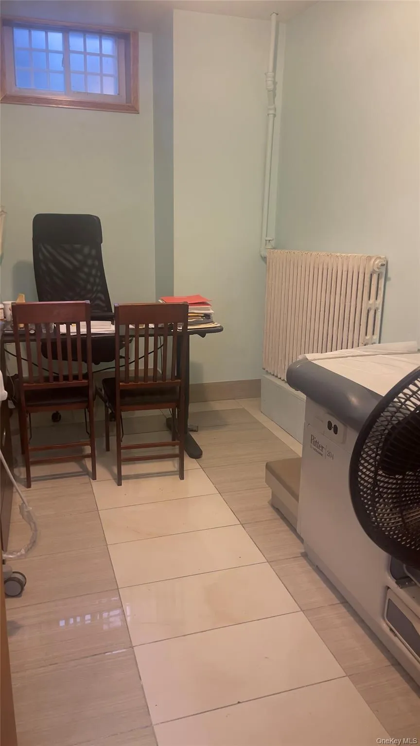 Dining space featuring radiator and baseboards Dining space featuring radiator and baseboards