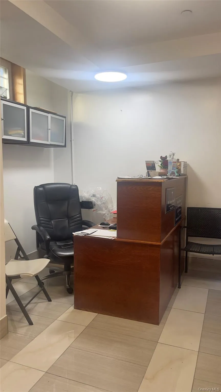 Office area featuring light tile patterned floors Office area featuring light tile patterned floors