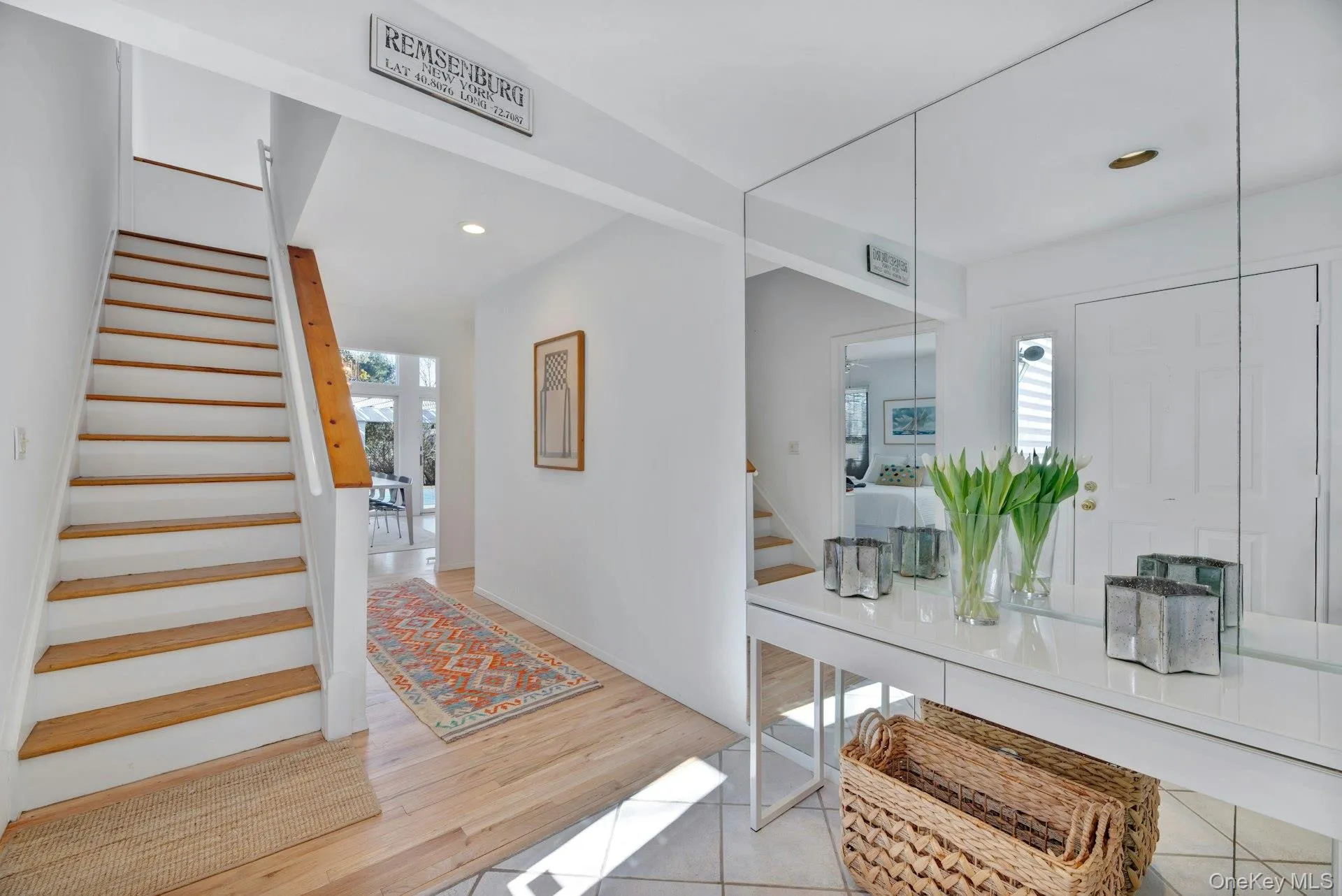 Foyer featuring recessed lighting, hard wood floors, and stairs to second floor sleeping area Foyer featuring recessed lighting, hard wood floors, and stairs to second floor sleeping area