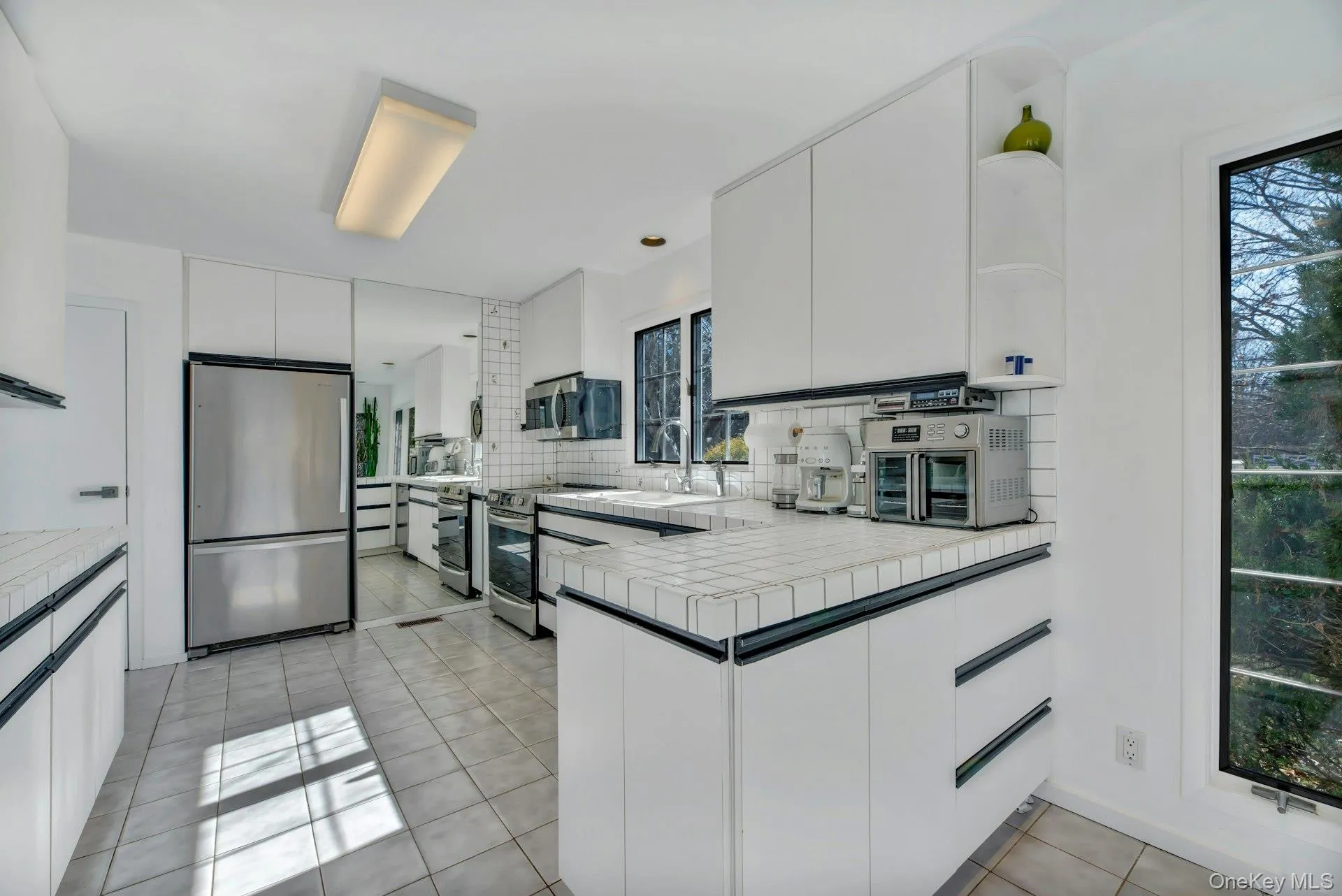 Overview of kitchen with stainless steel appliances Overview of kitchen with stainless steel appliances