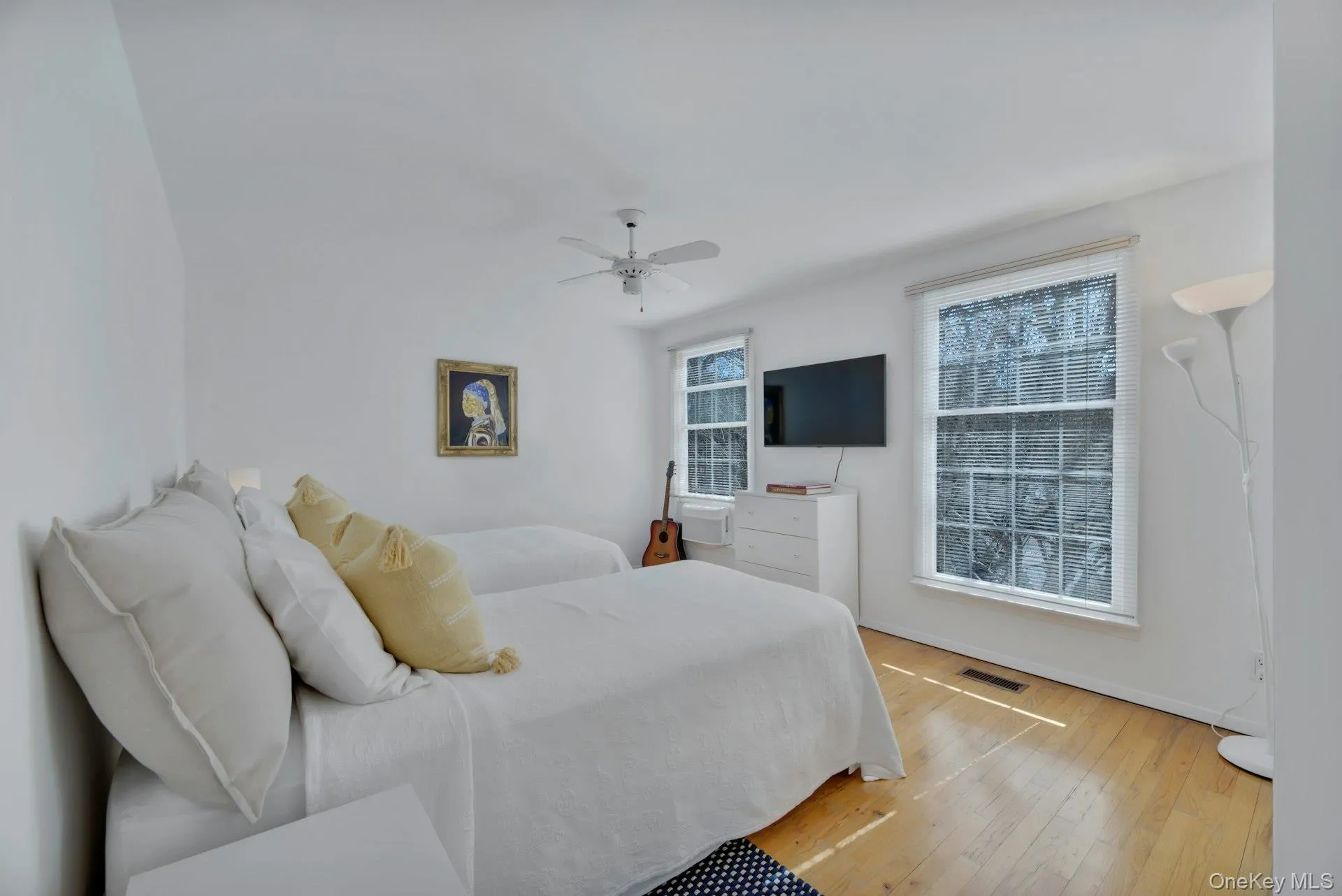 2nd floor twin bedroom featuring ceiling fan and television 2nd floor twin bedroom featuring ceiling fan and television