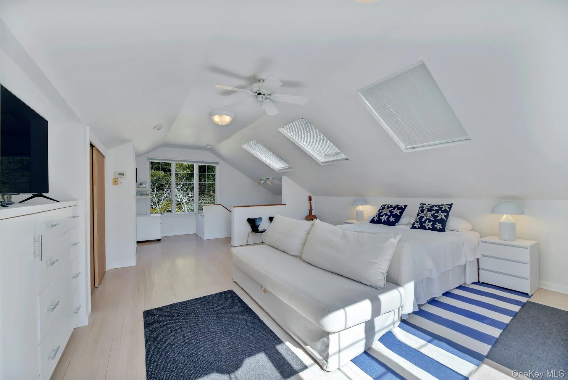 Private en-suite queen bedroom with separate entrance to its own exterior living space and common backyard. Office area with en-suite bathroom and featuring a ceiling fan & vaulted ceiling. Private en-suite queen bedroom with separate entrance to its own exterior living space and common backyard. Office area with en-suite bathroom and featuring a ceiling fan & vaulted ceiling.