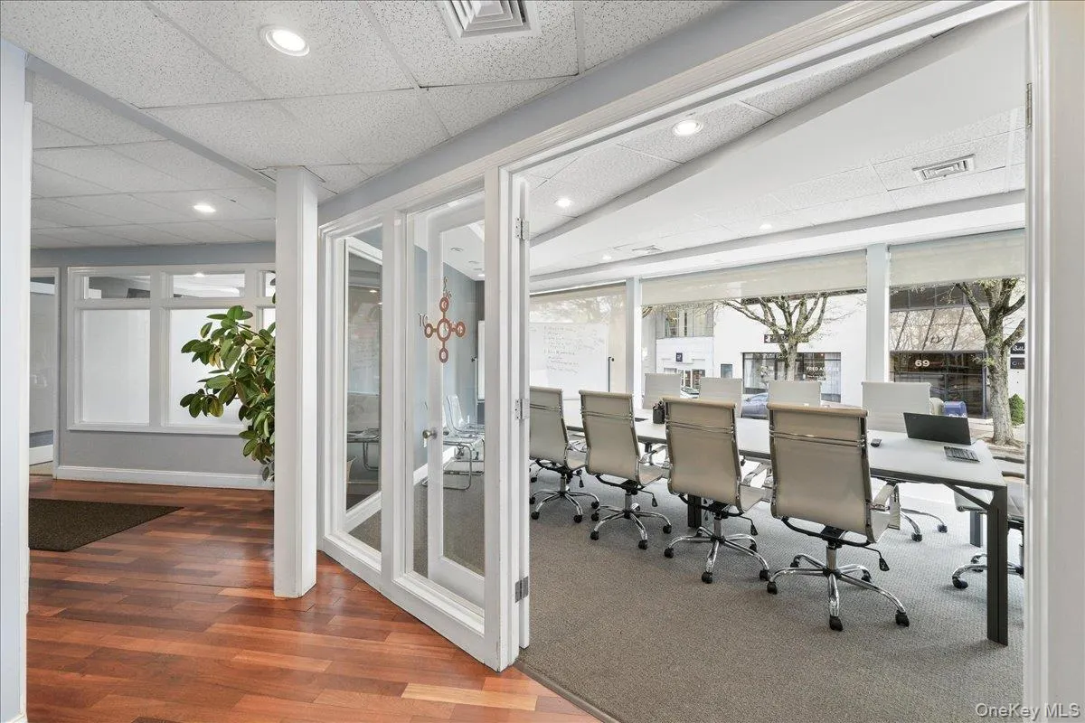Office area featuring a drop ceiling, wood finished floors, and recessed lighting Office area featuring a drop ceiling, wood finished floors, and recessed lighting