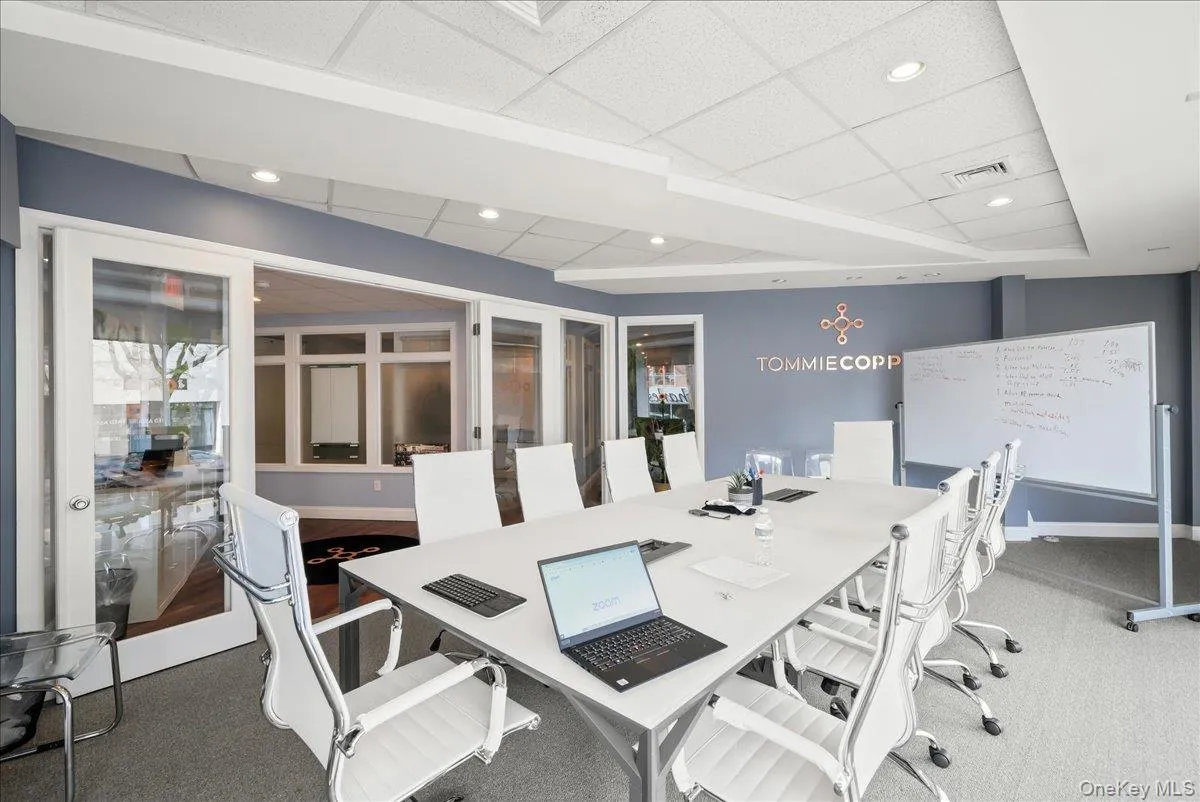 Carpeted office space featuring a drop ceiling and recessed lighting Carpeted office space featuring a drop ceiling and recessed lighting