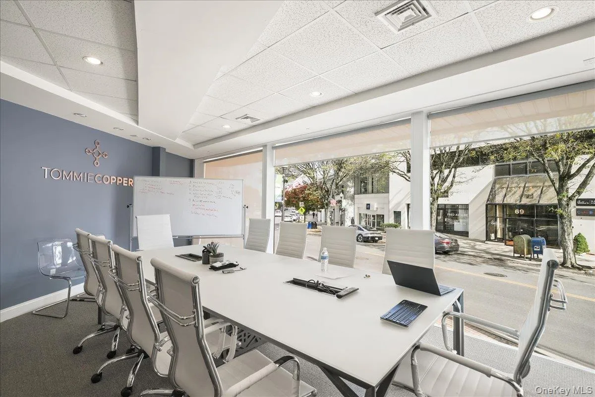 Office space featuring a paneled ceiling, recessed lighting, and carpet Office space featuring a paneled ceiling, recessed lighting, and carpet