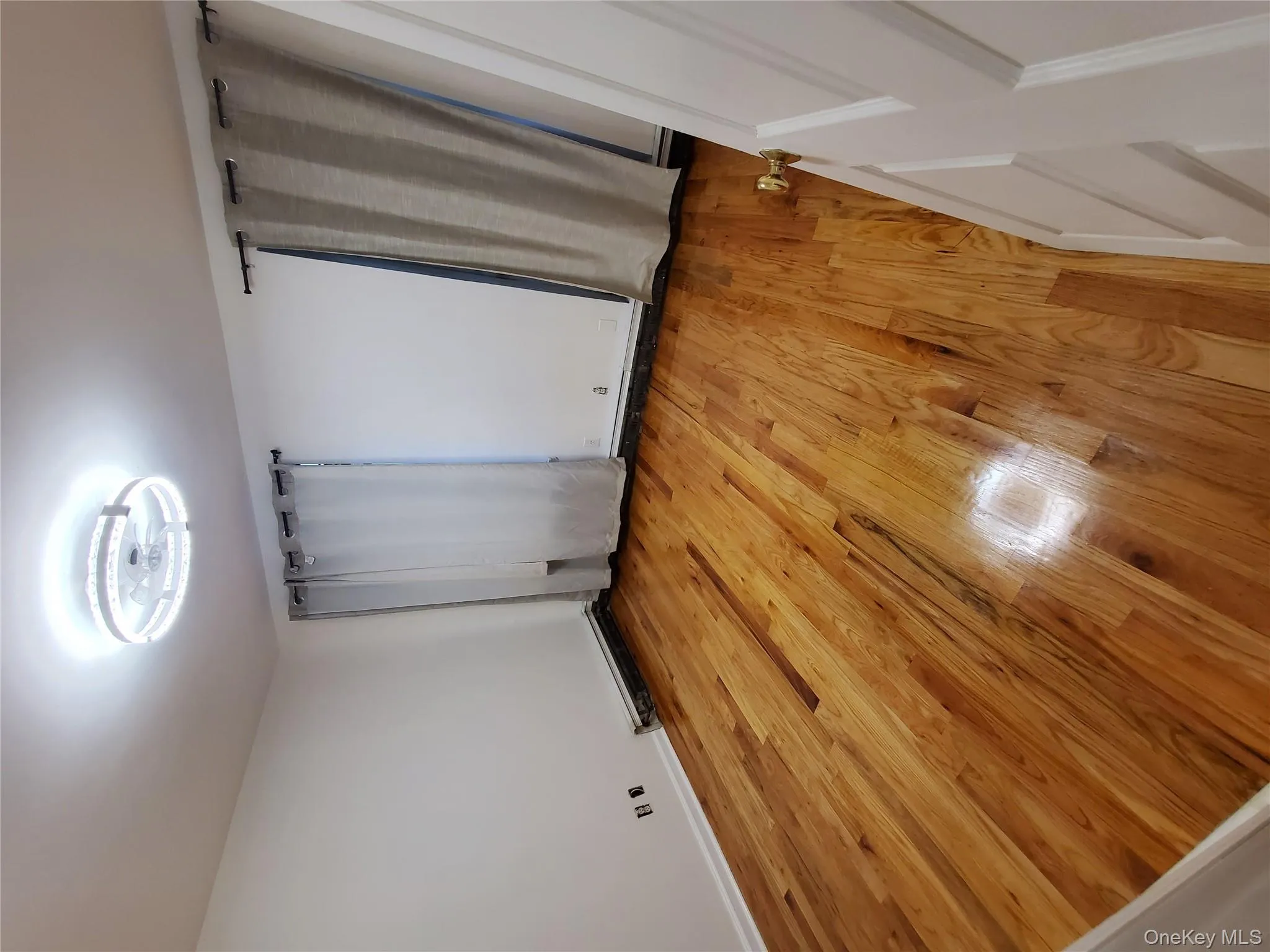 Unfurnished bedroom with light wood-style flooring and baseboards Unfurnished bedroom with light wood-style flooring and baseboards