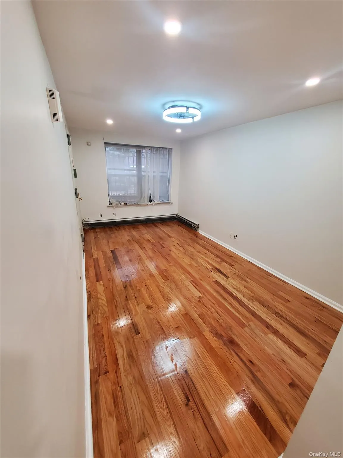 Unfurnished room featuring light wood-style floors and recessed lighting Unfurnished room featuring light wood-style floors and recessed lighting
