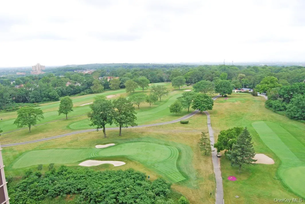 Aerial view of property's location featuring a golf club Aerial view of property's location featuring a golf club