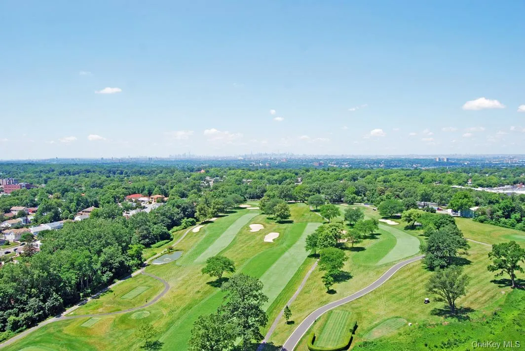 Aerial view of a golf course and a tree filled landscape Aerial view of a golf course and a tree filled landscape