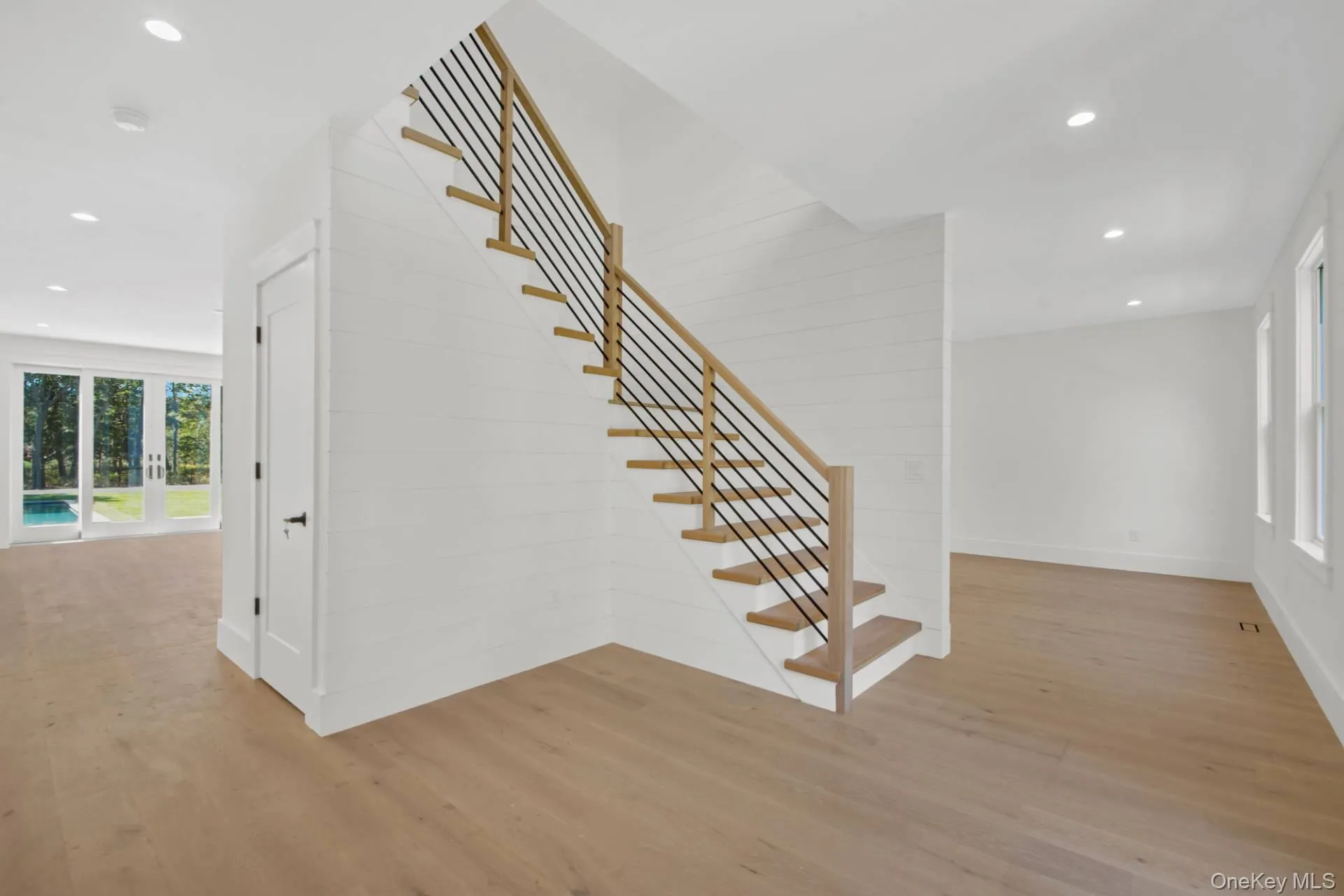 Stairway with recessed lighting and wood finished floors Stairway with recessed lighting and wood finished floors