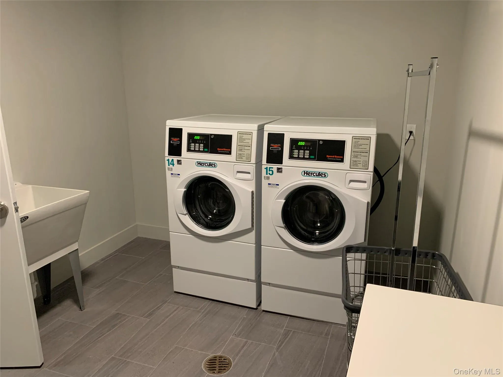 Community laundry featuring separate washer and dryer Community laundry featuring separate washer and dryer