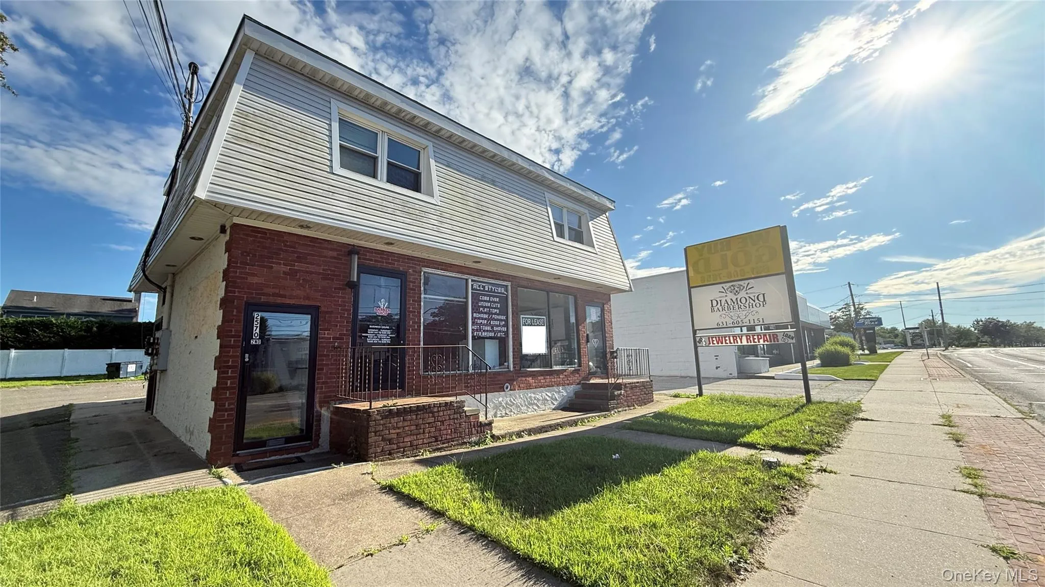 View of front of home featuring brick siding and a front yard View of front of home featuring brick siding and a front yard