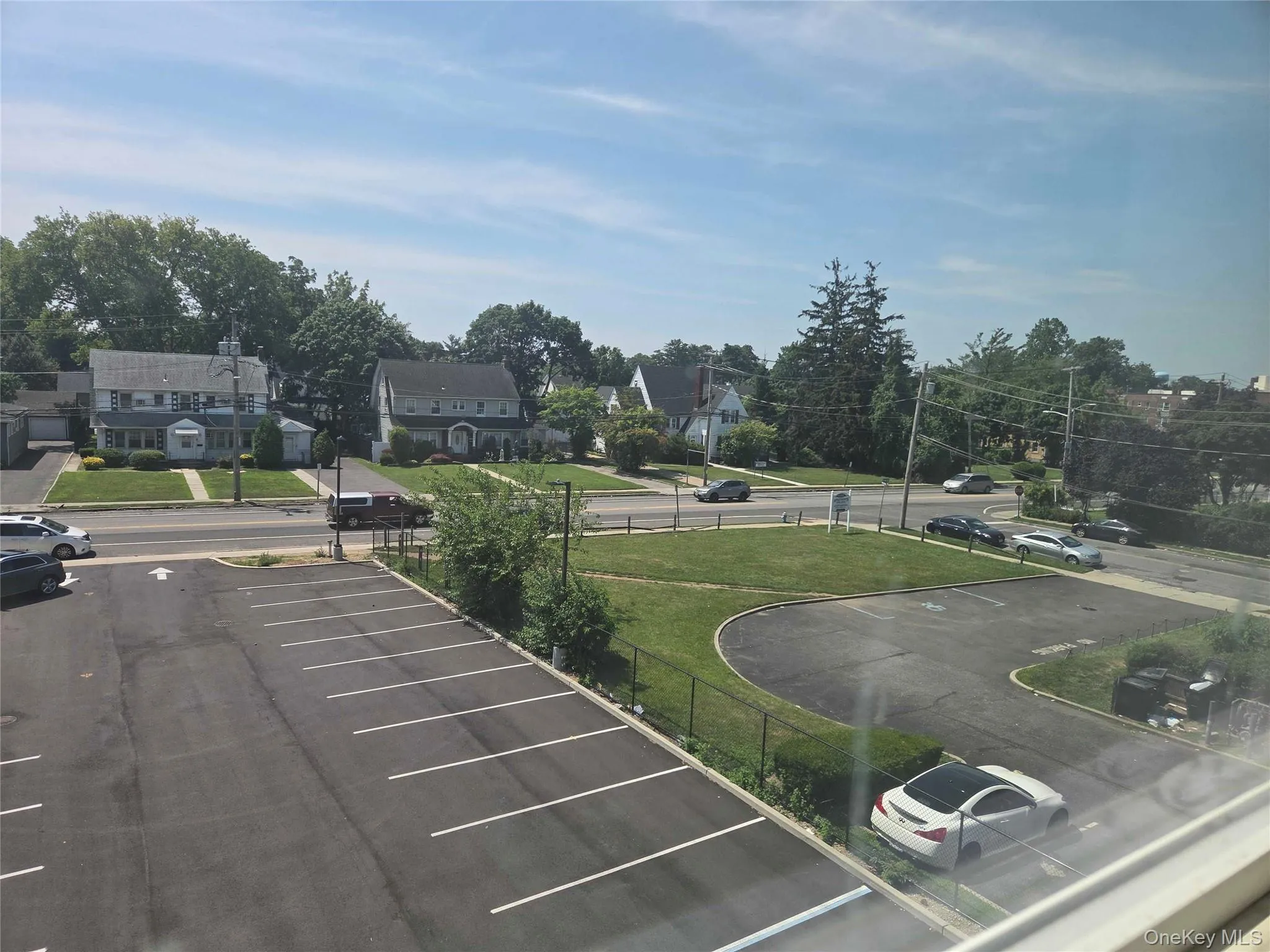Uncovered parking lot with a residential view Uncovered parking lot with a residential view