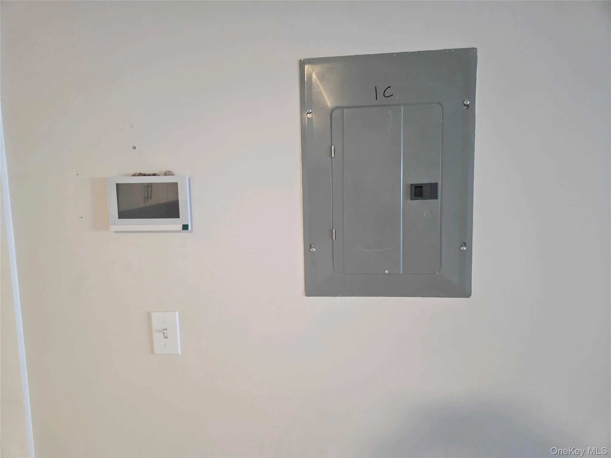 Utility room featuring electric panel Utility room featuring electric panel