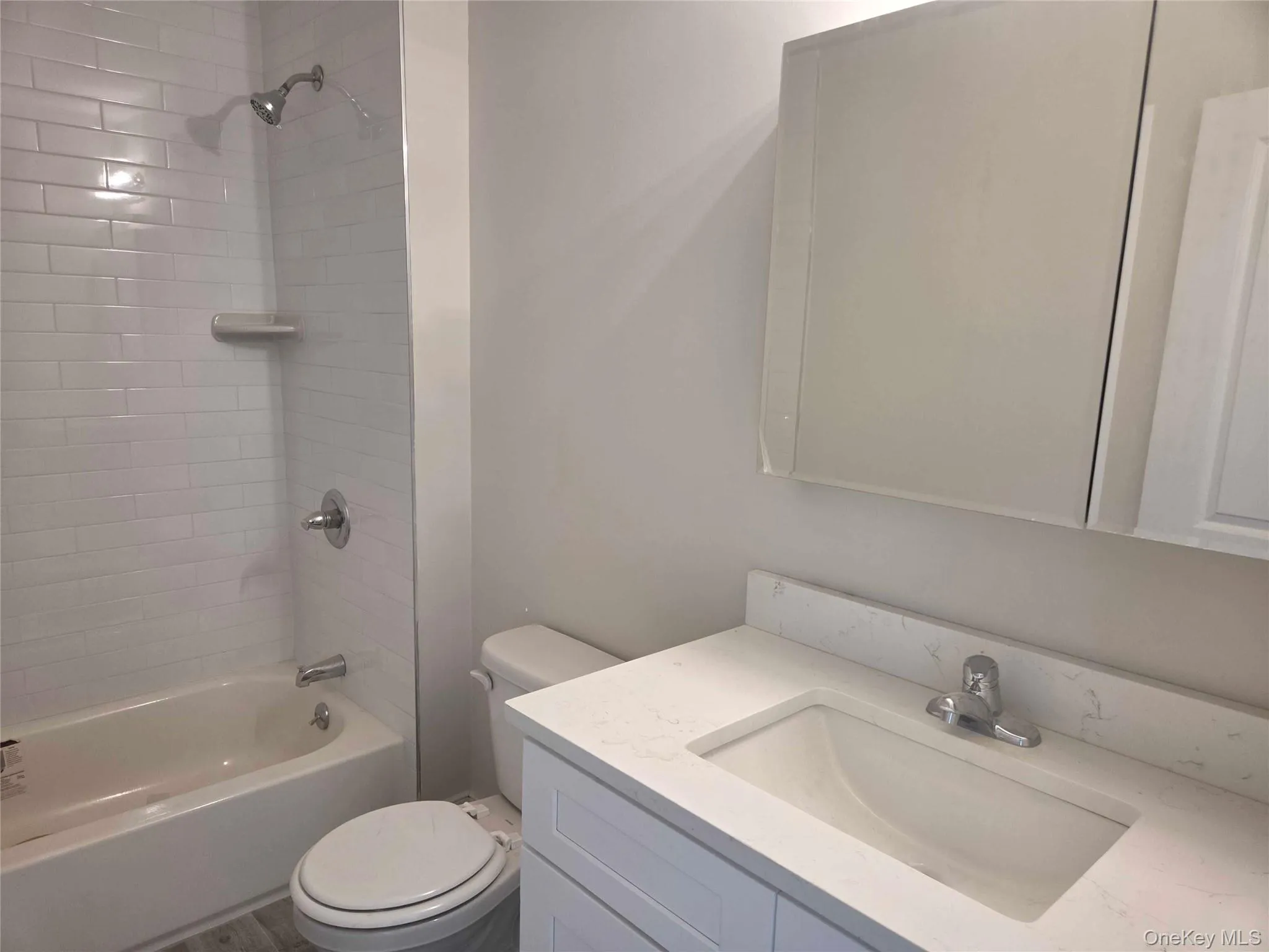 Full bathroom with washtub / shower combination and vanity Full bathroom with washtub / shower combination and vanity