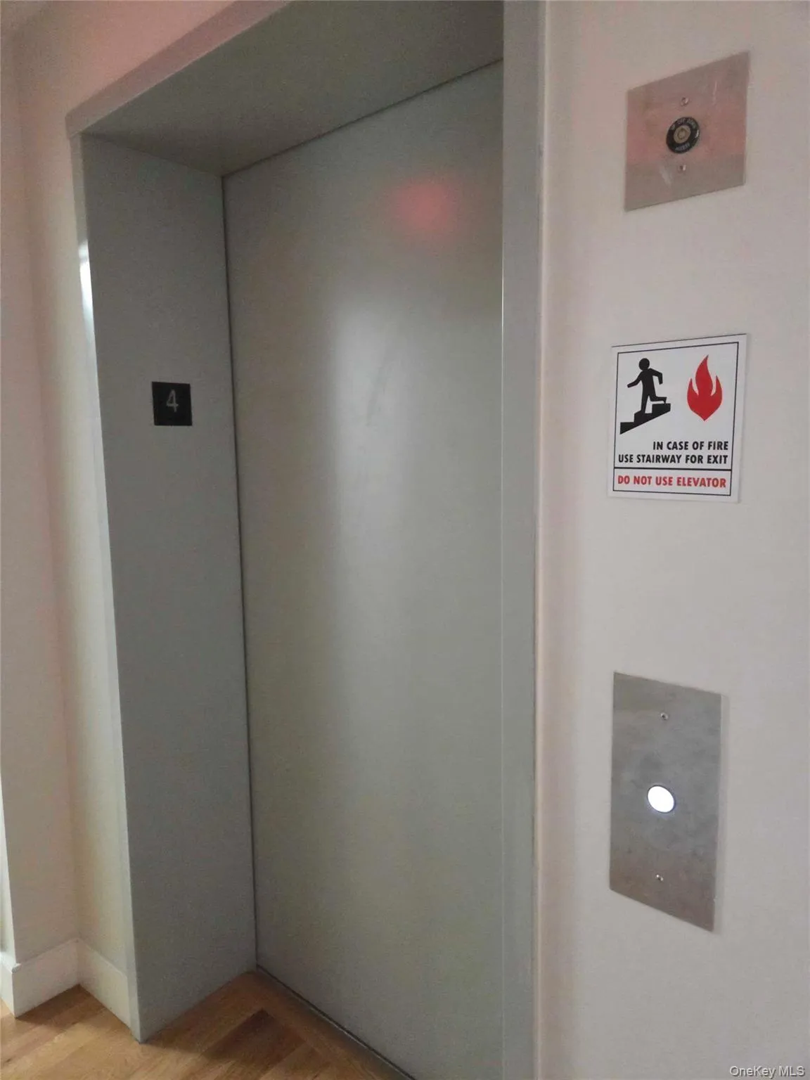 Detailed view of elevator and wood finished floors Detailed view of elevator and wood finished floors