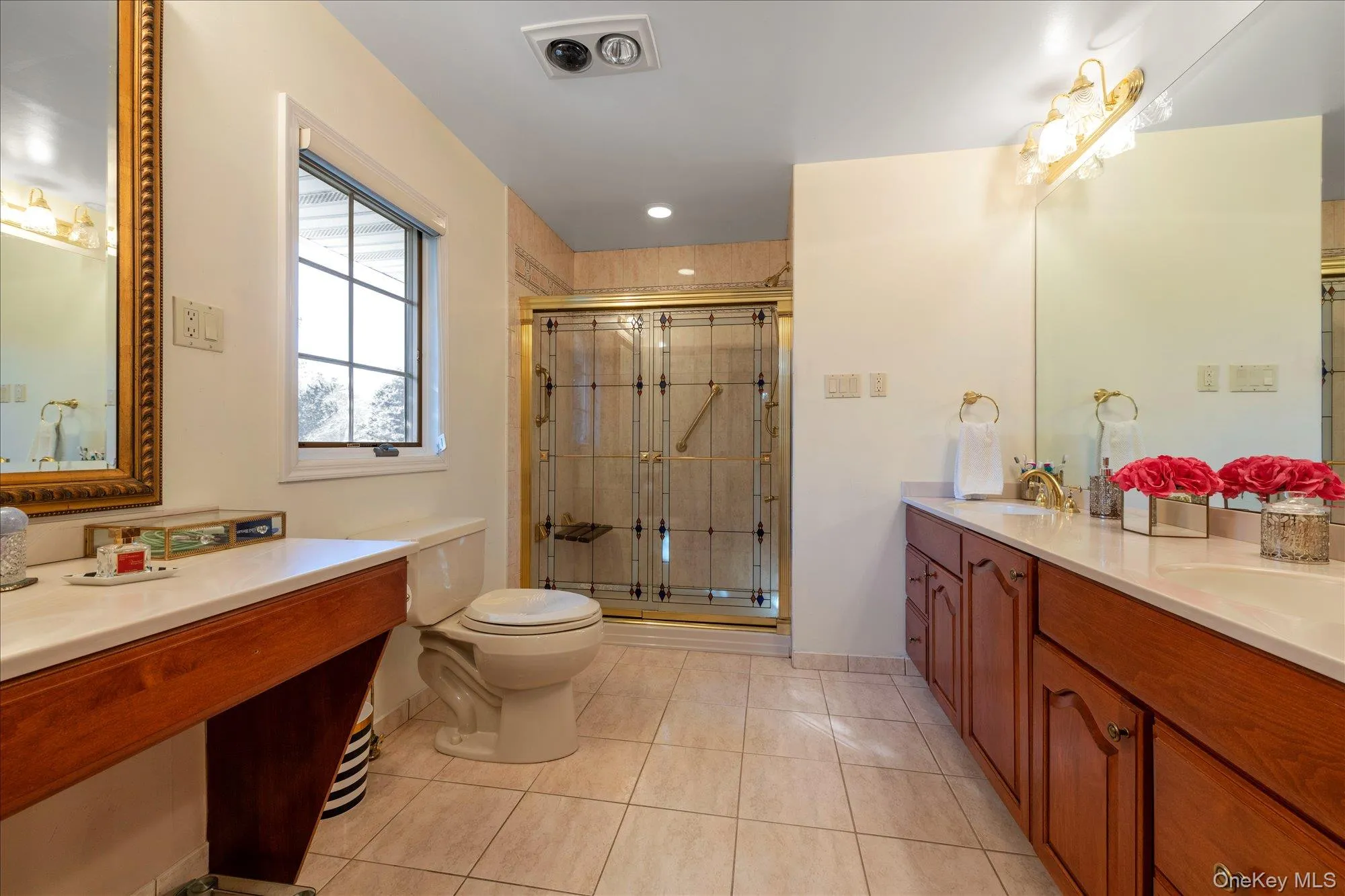 Full bathroom featuring light tile patterned floors, a shower stall, double vanity, and recessed lighting Full bathroom featuring light tile patterned floors, a shower stall, double vanity, and recessed lighting